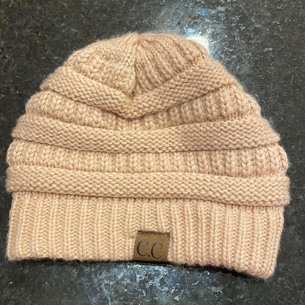 Brand new pink CC winter hat. Fleece lined. Never worn!